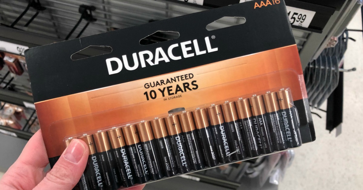 hand holding Duracell batteries