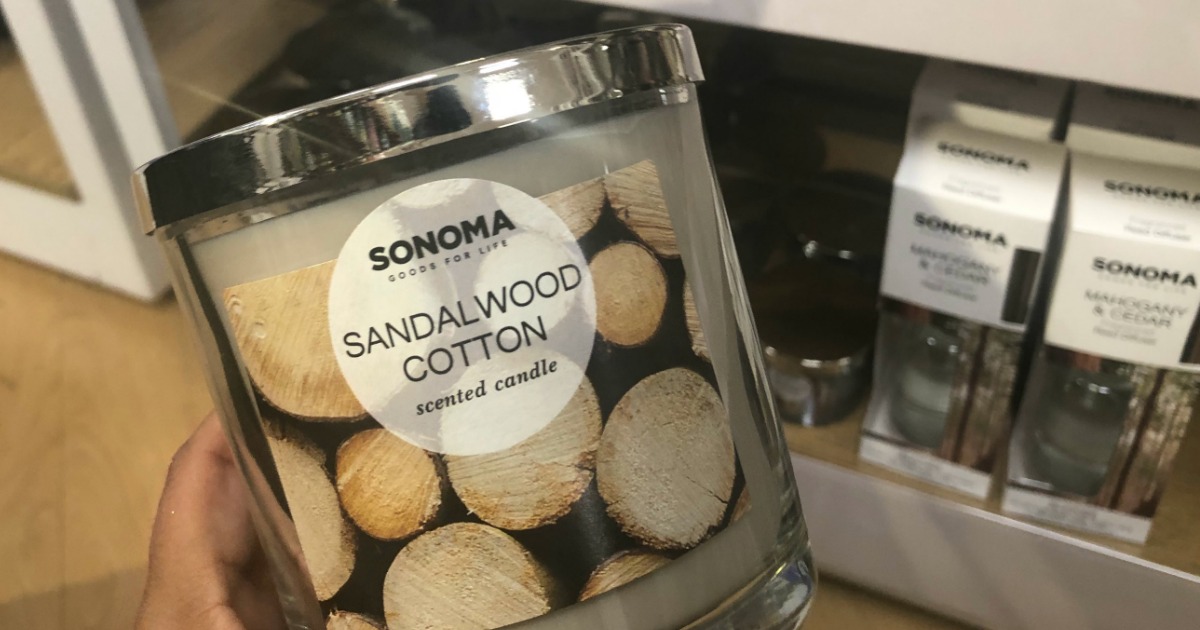 hand holding up sonoma candle