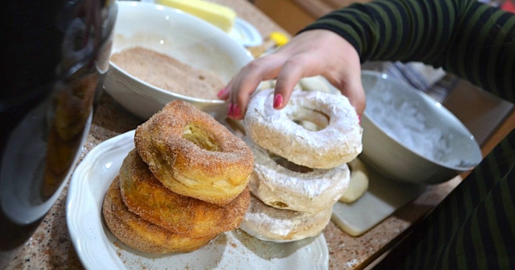 child picking up air fryer donut