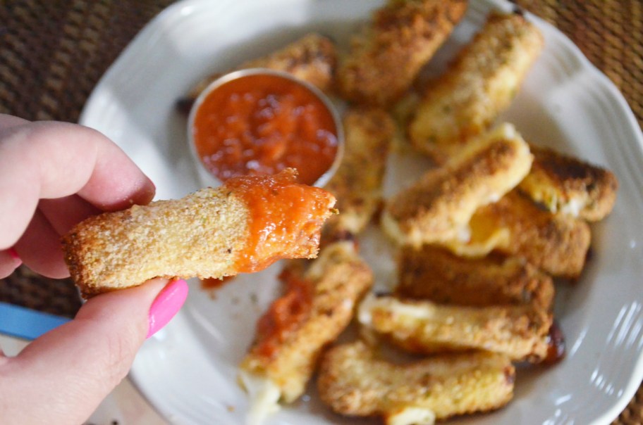 a plate of air fryer mozzarella sticks