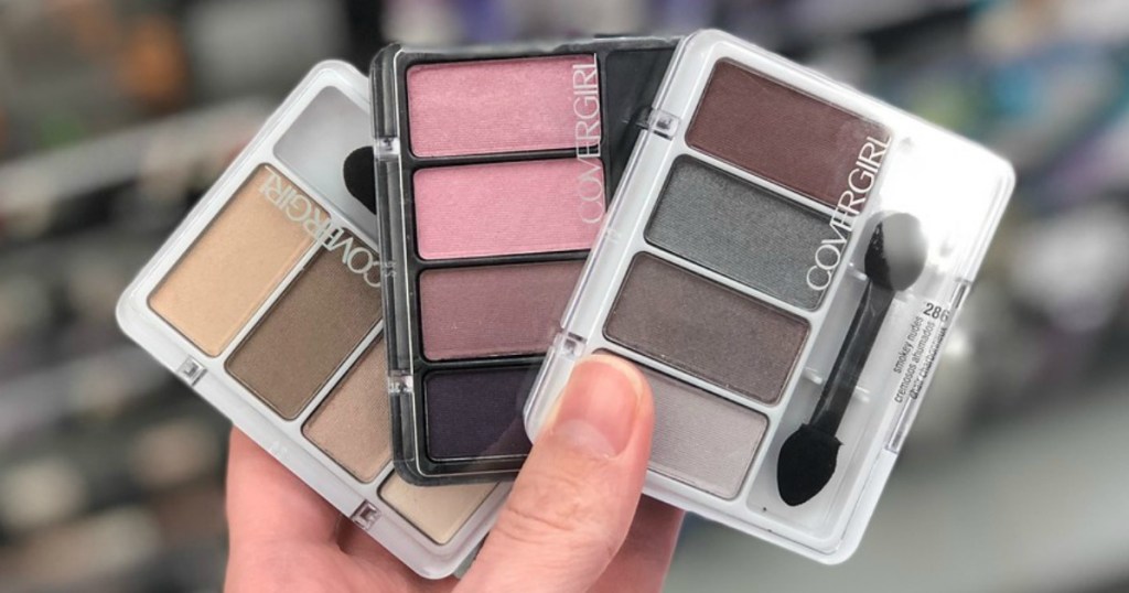 hand holding CoverGirl eyeshadows