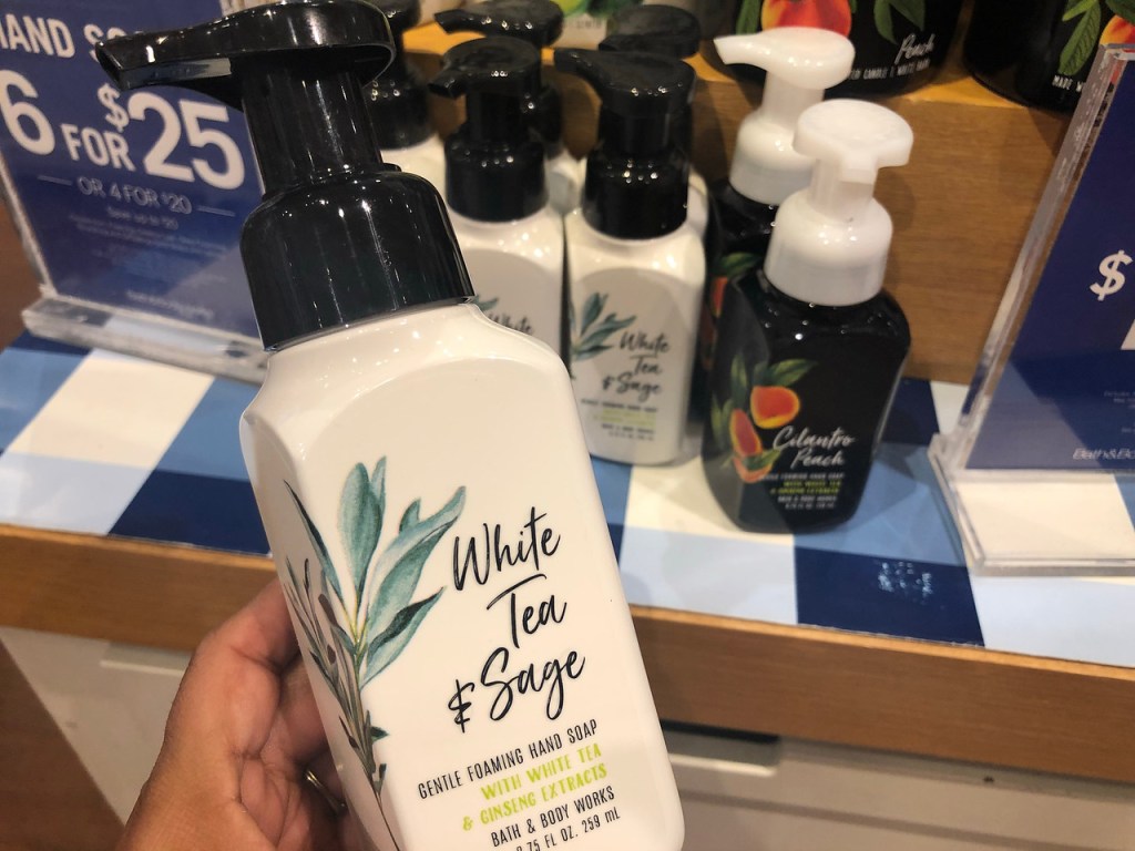 hand holding white tea & sage hand soap