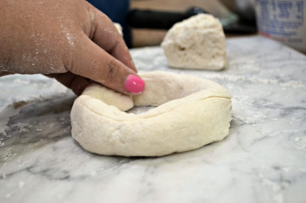 raw bagel on marble countertop