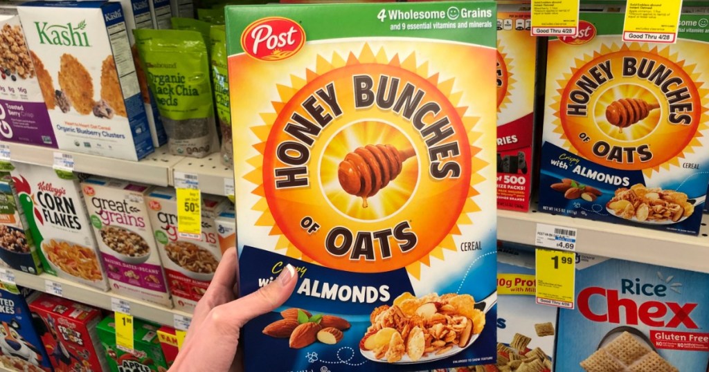 hand holding box of Honey Bunches of Oats cereal