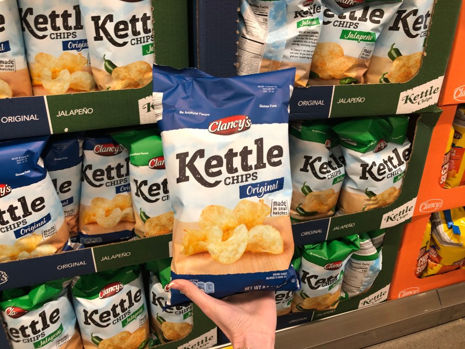 hand holding bag of ALDI kettle chips