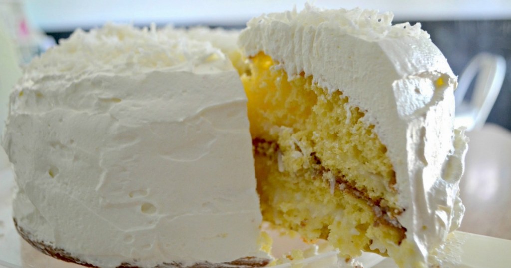 pulling out slice of coconut cake 