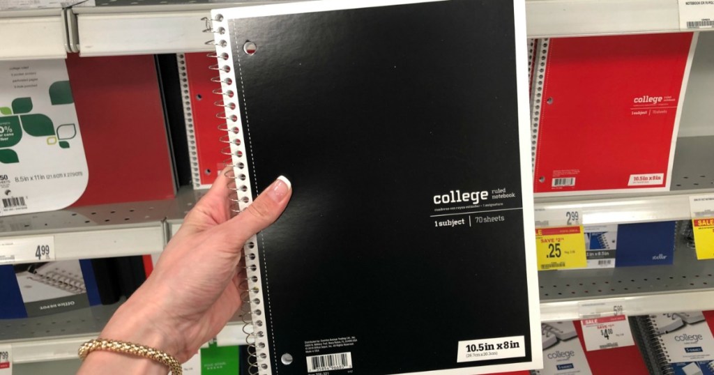 hand holding Office Depot notebook