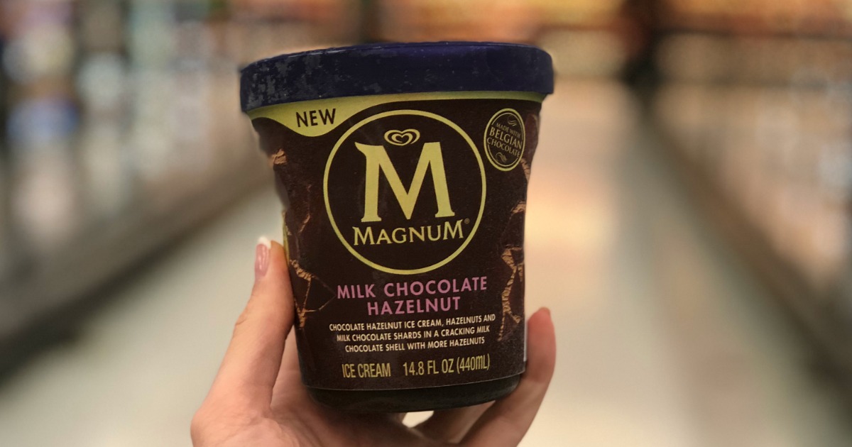 hand holding container of magnum ice cream