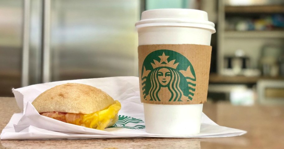 starbucks breakfast sandwich and drink on kitchen counter