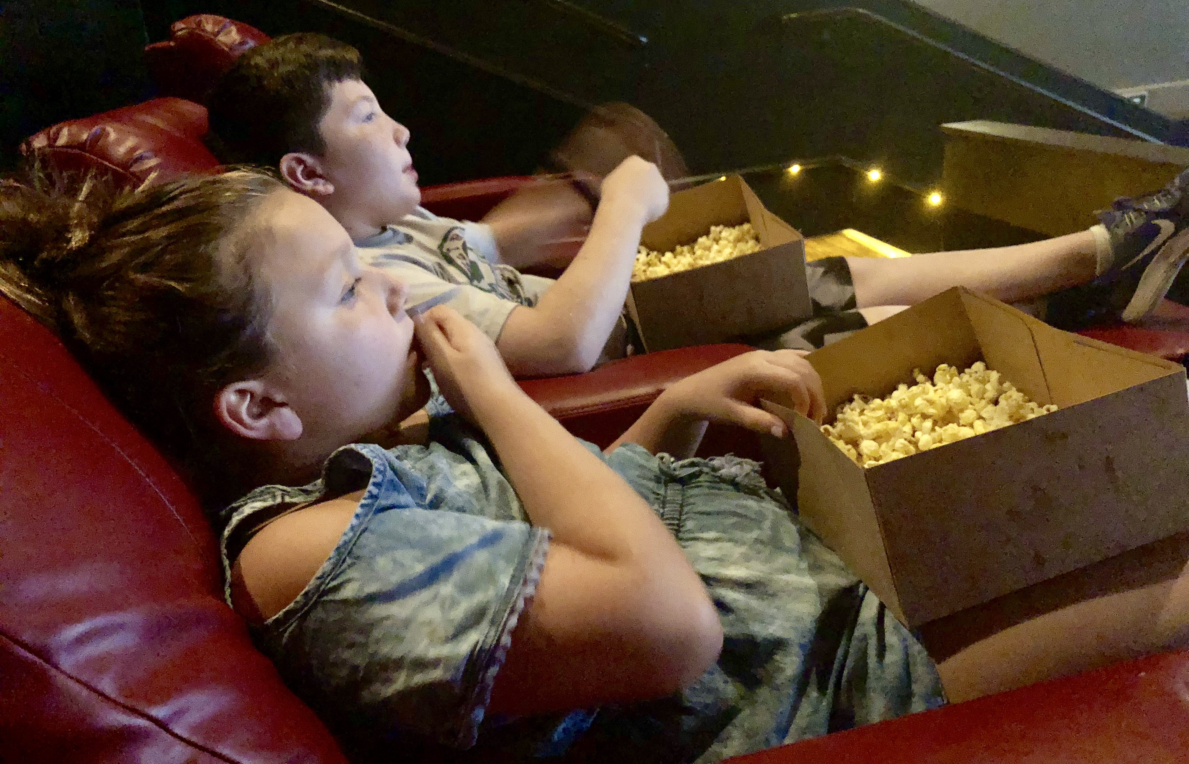 movies amc launching subscription moviepass - kids watching a movie