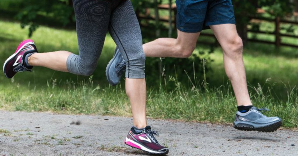 two people running in brooks running shoes