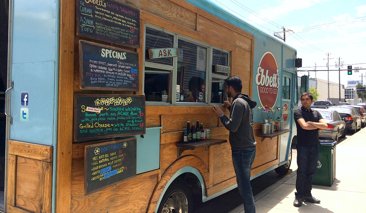 food truck with two men standing nearby