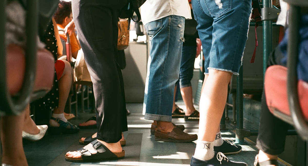 people standing on a public bus