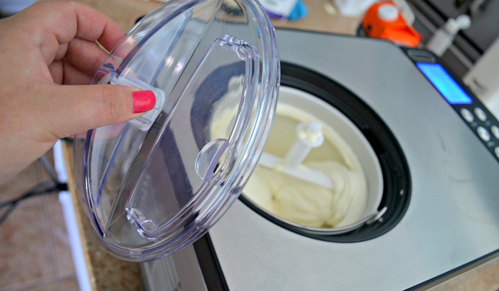 person taking lid off whynter ice cream maker