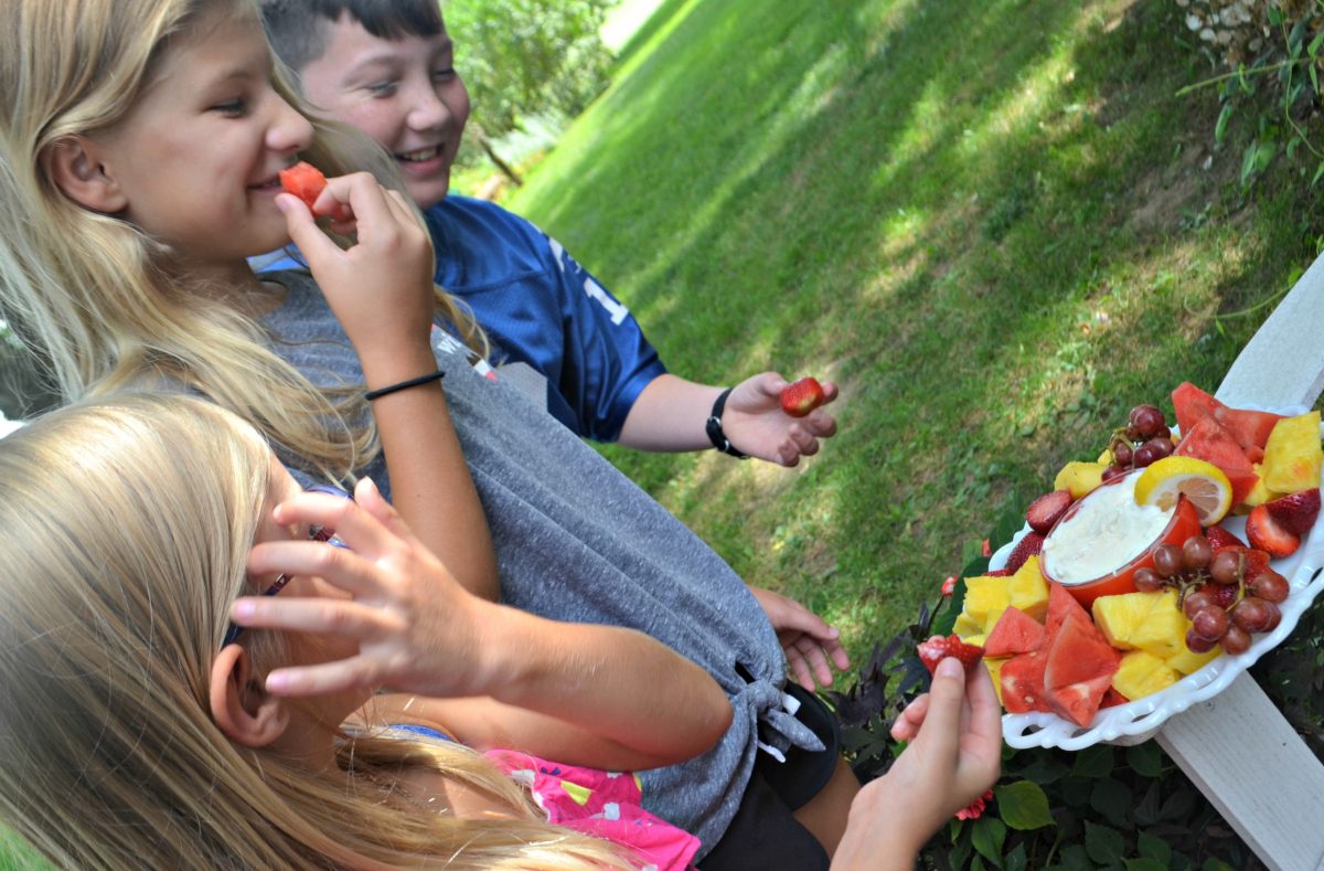 kids enjoying the fruit dip