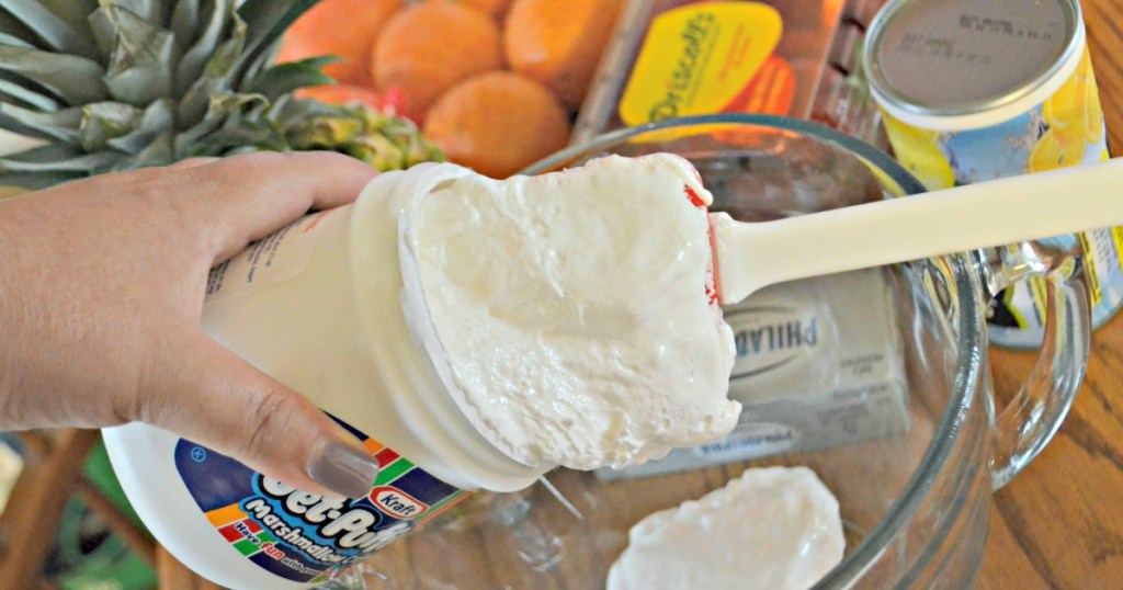 mixing fruit dip in a bowl 