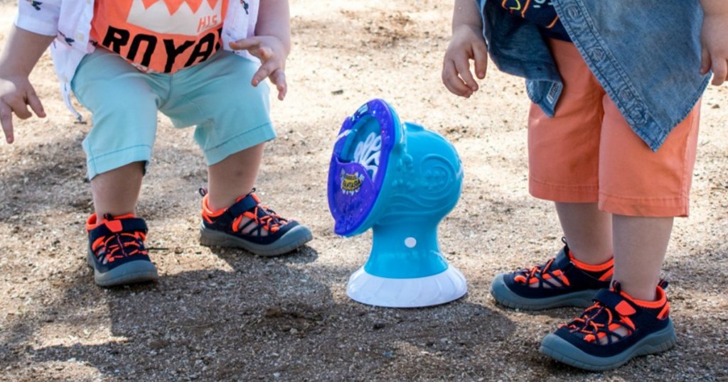 OshKosh B'Gosh Closed Toe Sandals on toddlers playing in the sand at beach