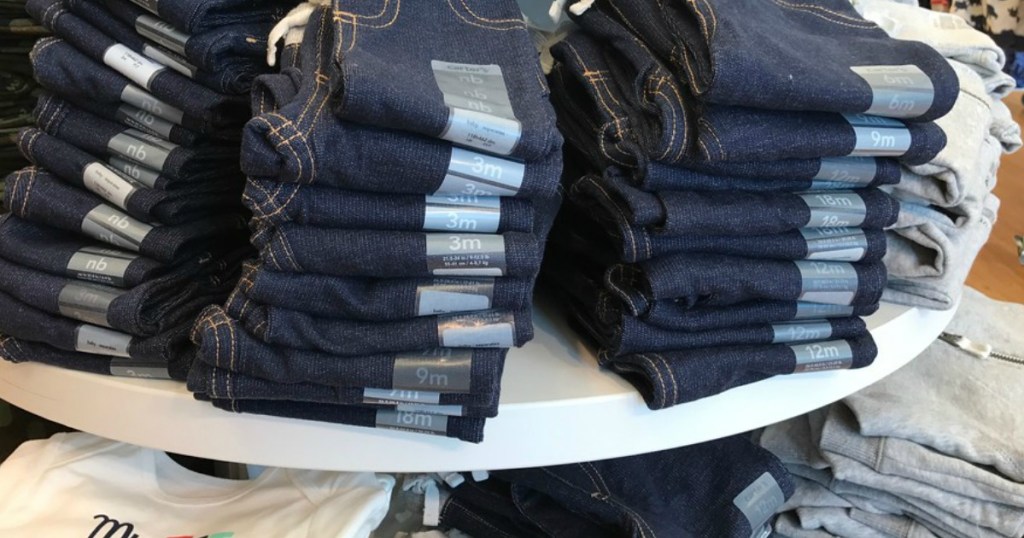 oshkosh jeans on table