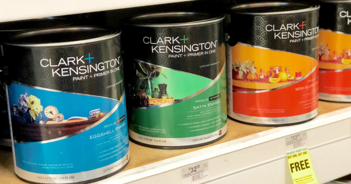 colorful cans of paint lined up on a store shelf