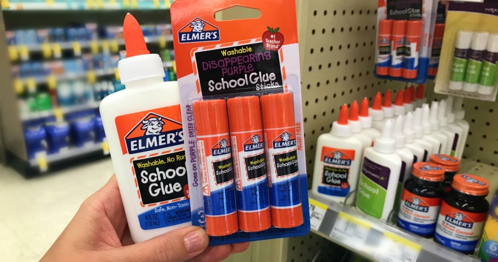 hand holding Elmer's school glue