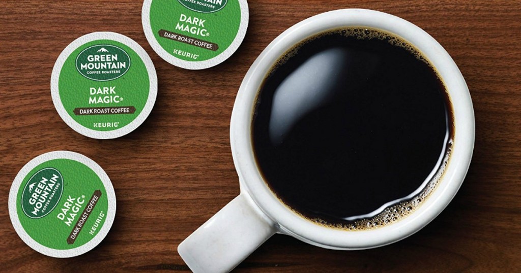 green mountain dark roast k-cups next to cup of coffee