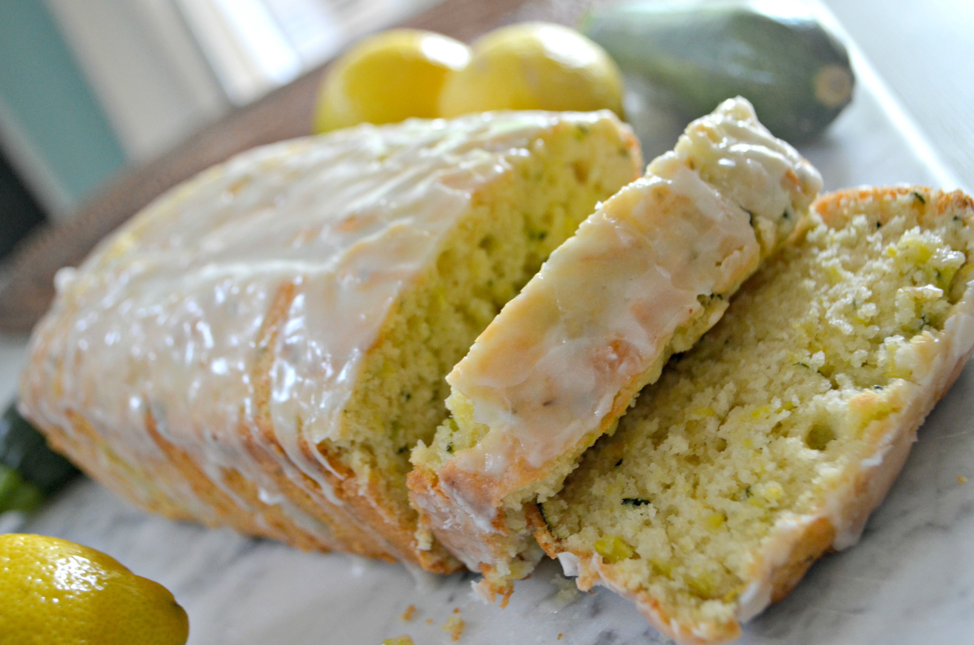 Sliced, glazed, baked lemon zucchini bread loaf