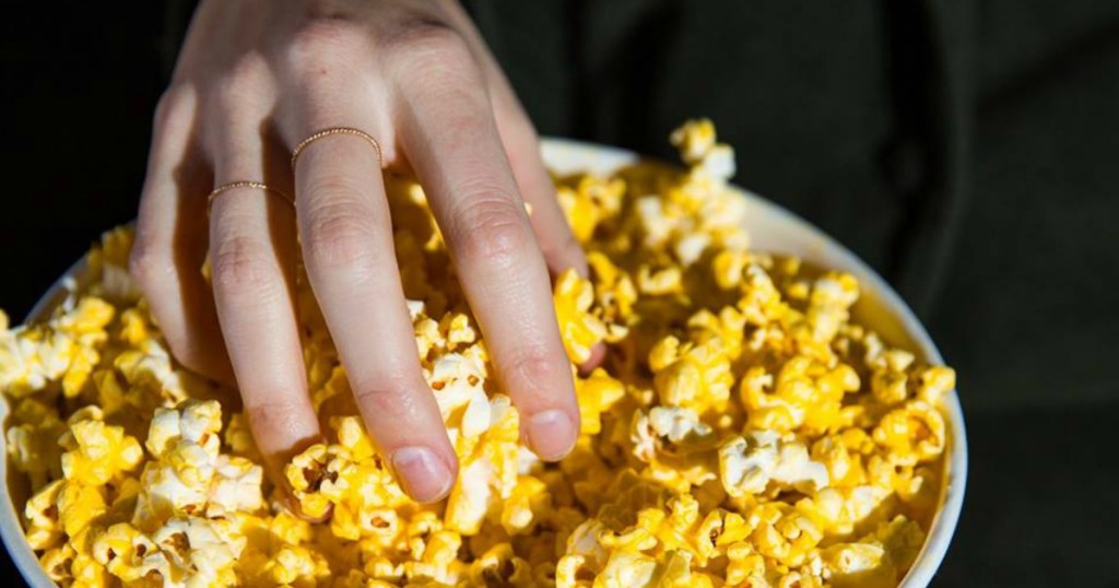 hand in popcorn