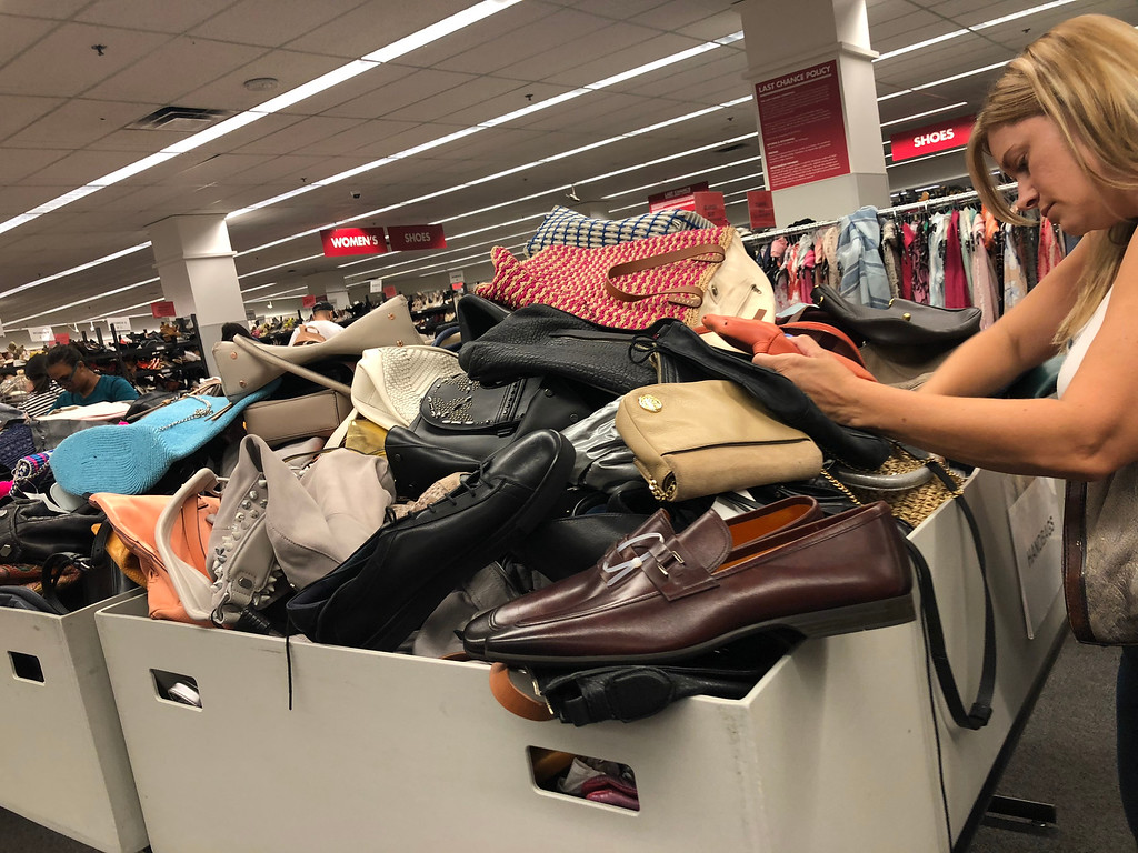  nordstroms last-chance store deals, tips, and tricks – woman searching in a bin