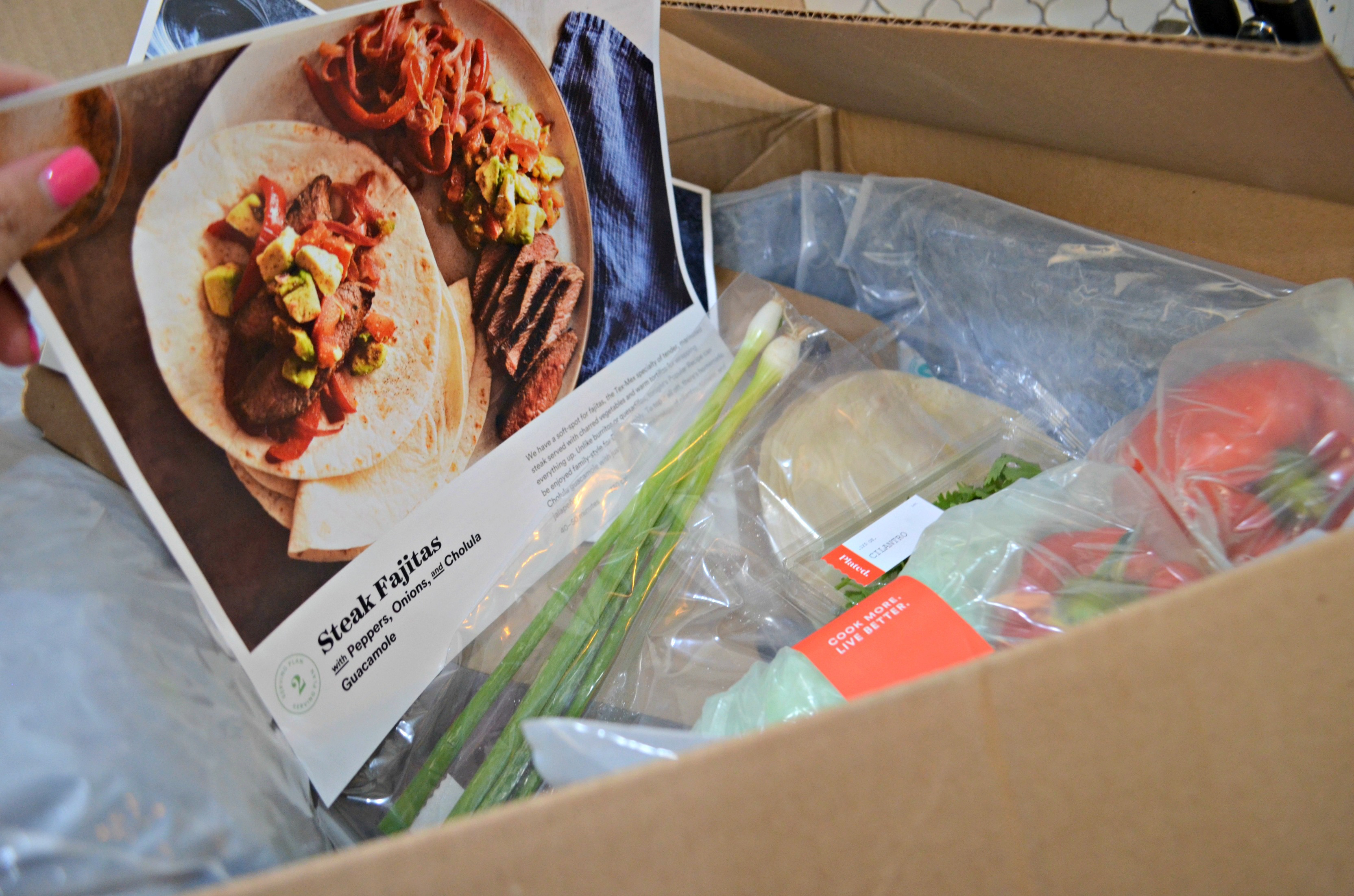 deal plated meal kit – Plated subscription box ingredients and recipe card for fajitas.