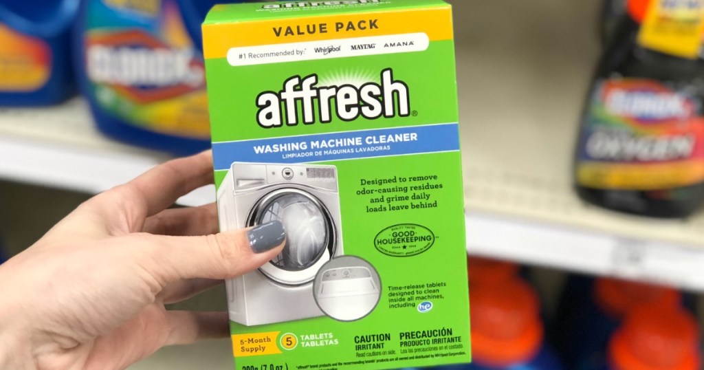 woman's hand holding affresh Washing Machine Cleaner