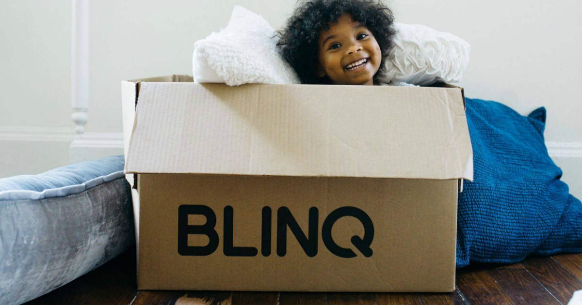 Girl smiling sitting in a BLINQ box 