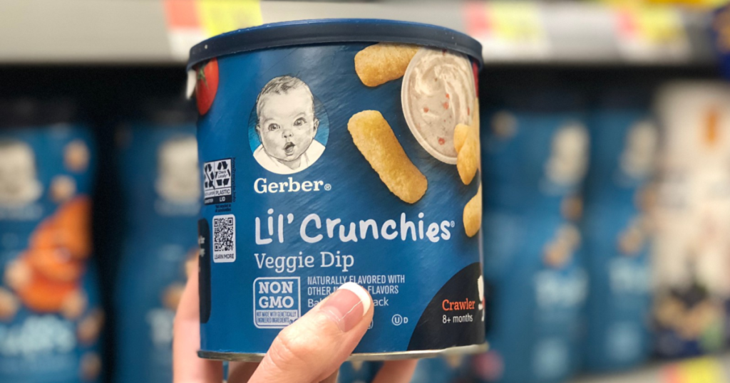 Hand holding up Gerber Lil Crunchies Veggie Dip