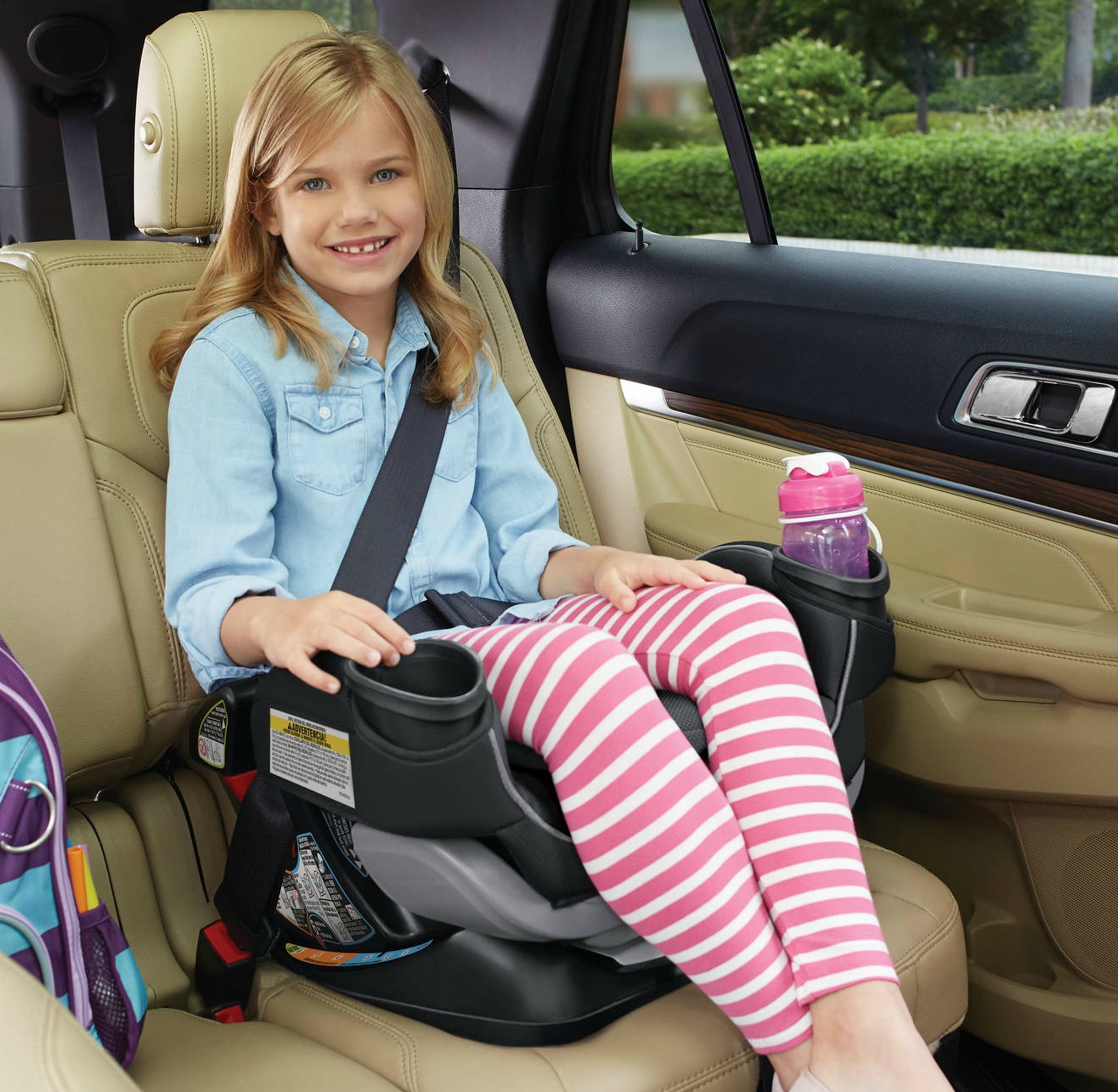 young girl in Graco booster seat