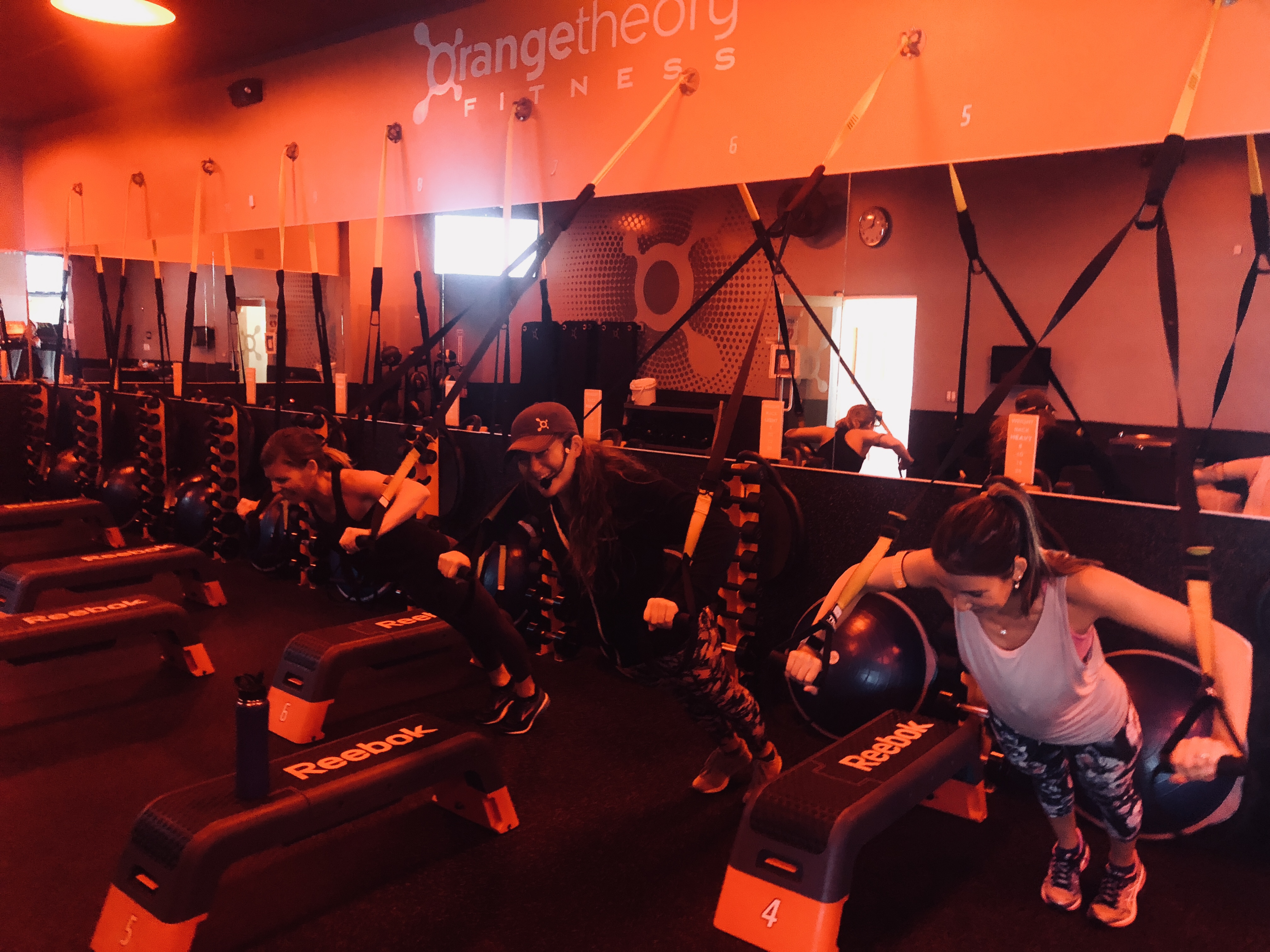 orangetheory fitness review – Erica working out with her instructor