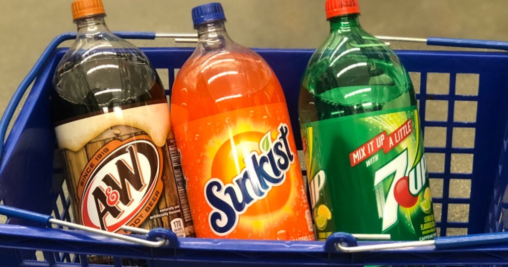 a&w, sunkist, 7up 2-liters in blue shopping basket