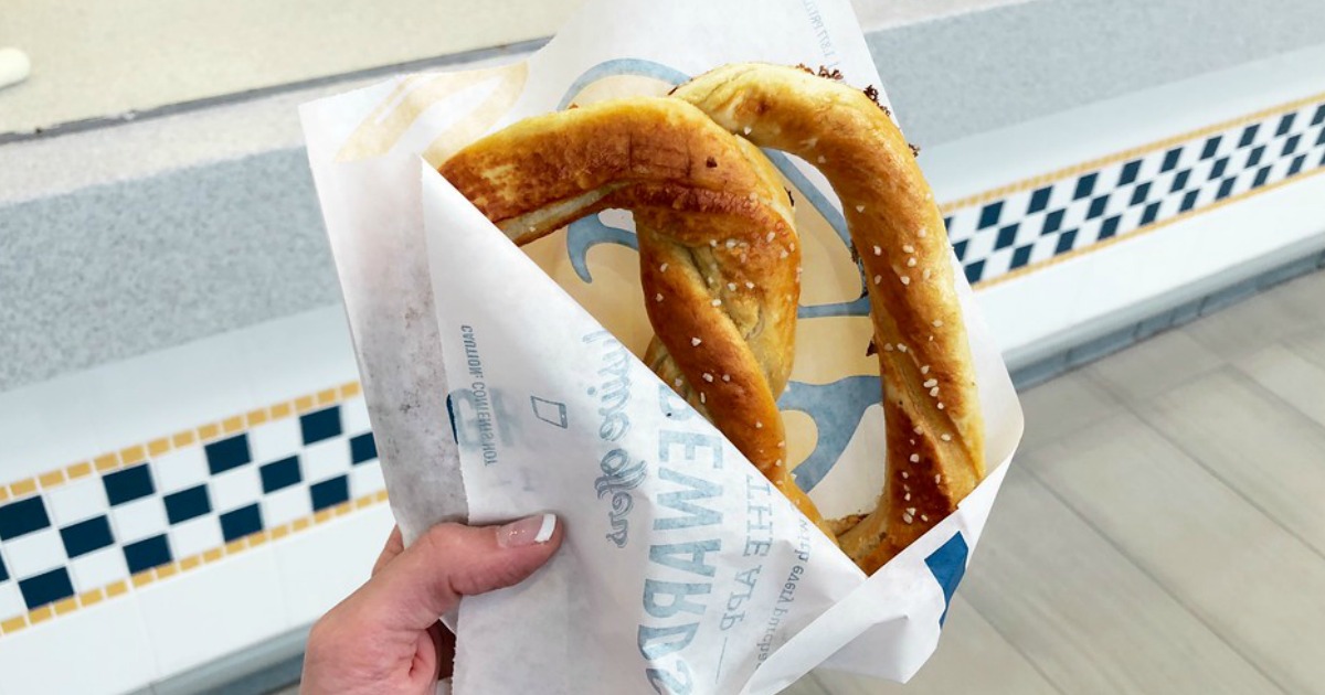 hand holding a salted auntie annes pretzel