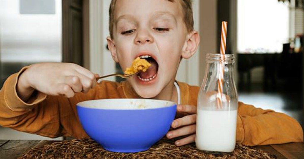 boy eating Kraft Mac & Cheese from a bowl