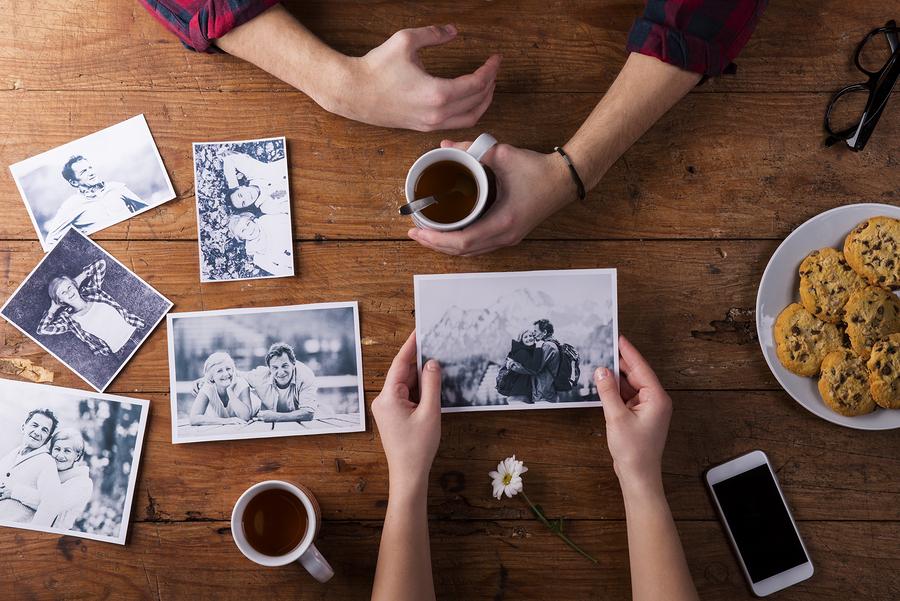 People looking at old photos Ancestry.online