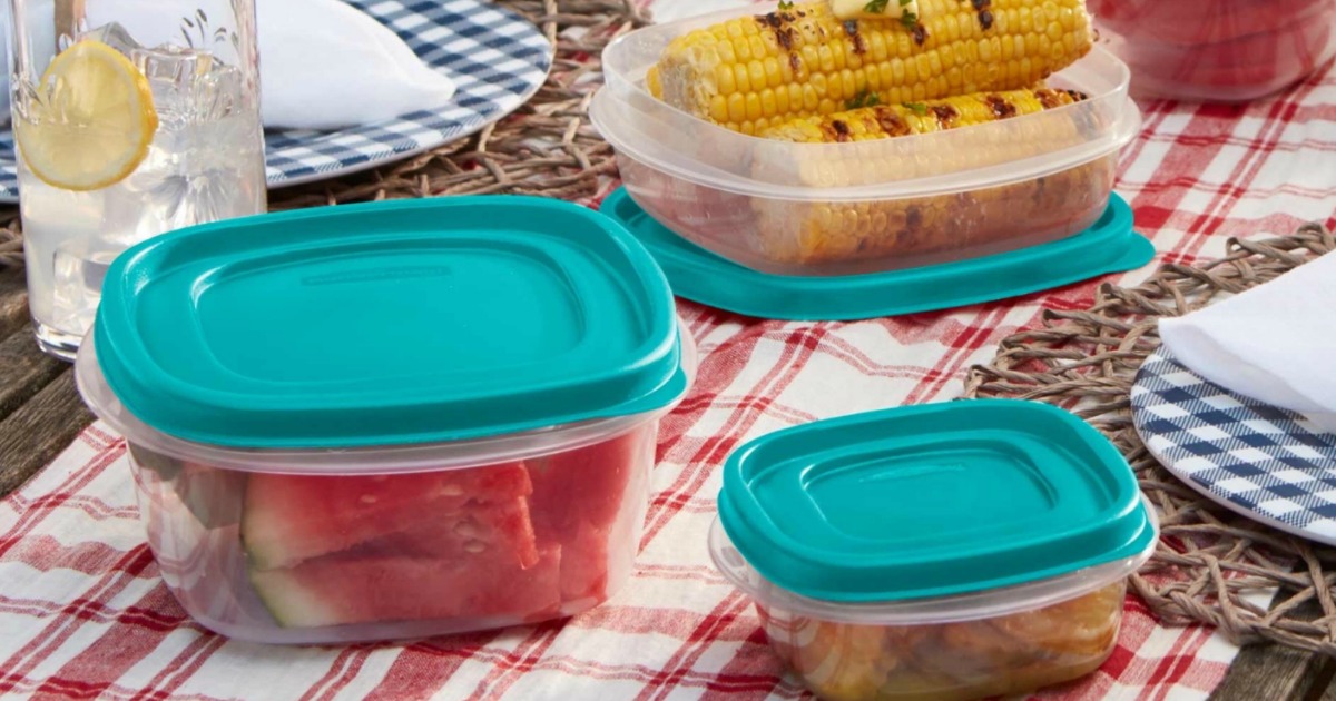 plastic storage containers with lids full of food on a picnic blanket