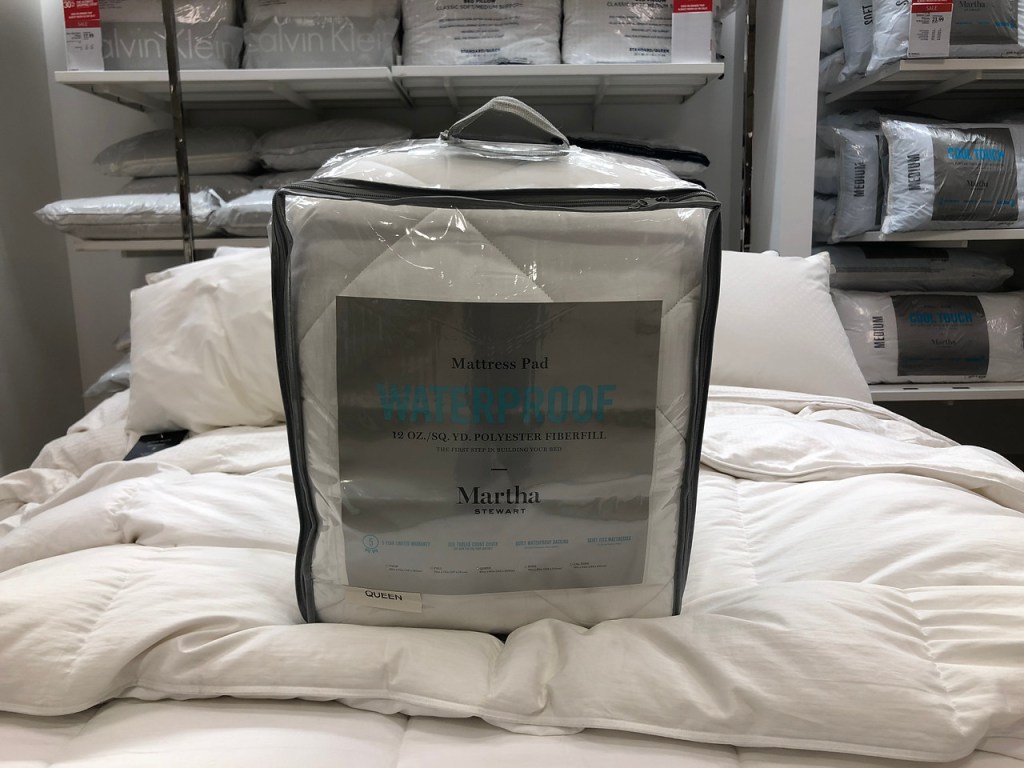 martha stewart waterproof mattress pad sitting on bed