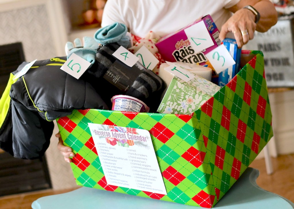 christmas box filled with reverse advent calendar stuff