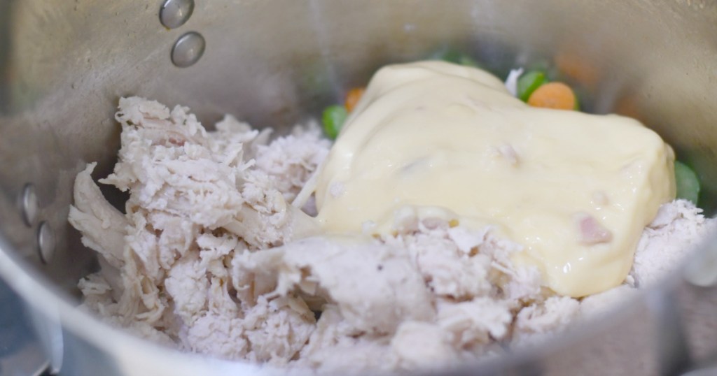 adding condensed soup to creamy chicken soup