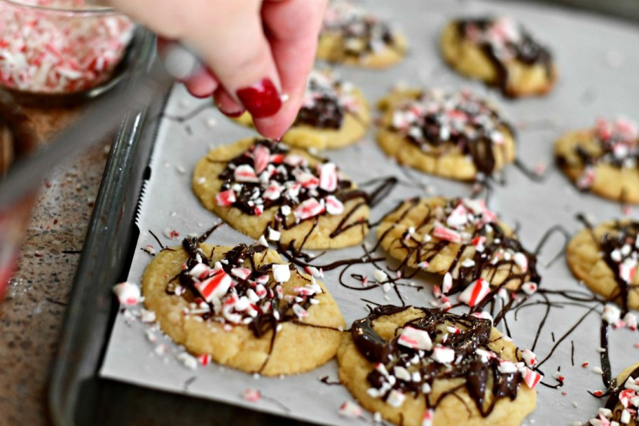 cookie dough christmas cookies recipe – peppermint chocolate drizzle cookies on a cookie sheet