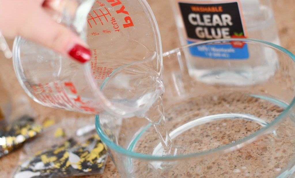 pouring clear glue into a bowl