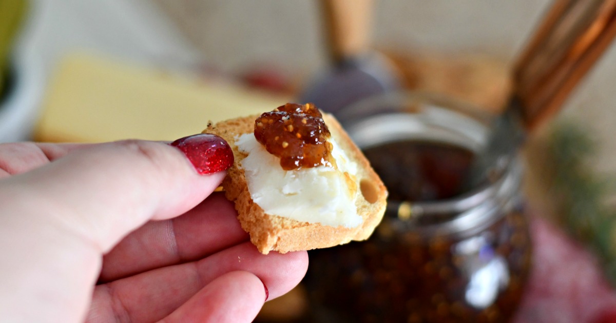 bread, cheese, jam on charcuterie board