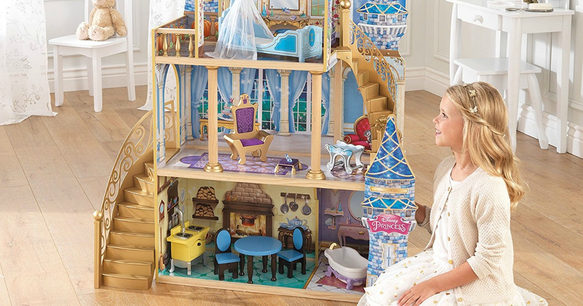 girl playing with princess dollhouse