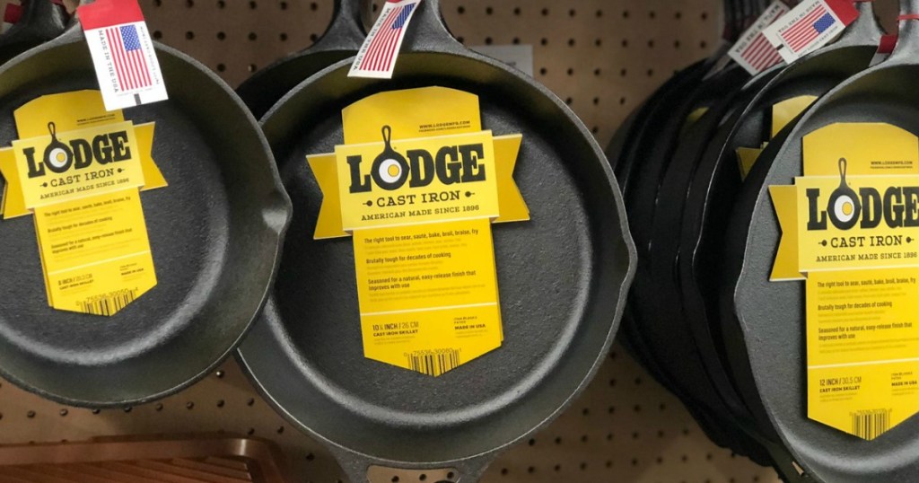 multiple lodge cast iron skillets hanging in shelf at walmart