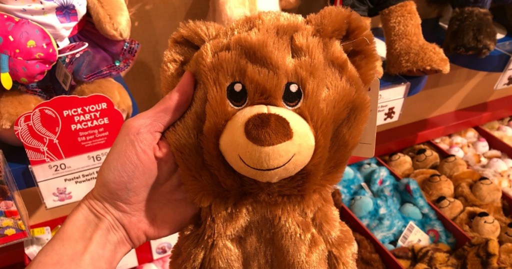 hand holding a bear from Build-A-Bear