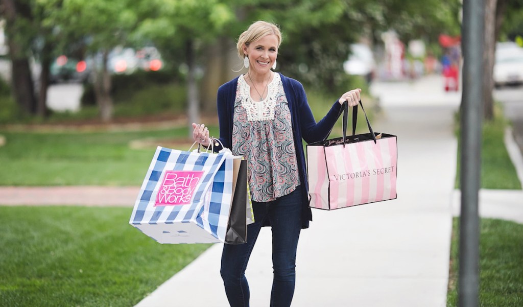 collin carrying shopping bags victorias secret bath and body works