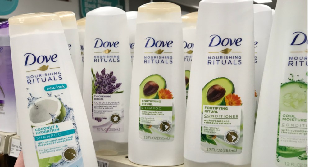 four bottle of dove shampoo on shelf 